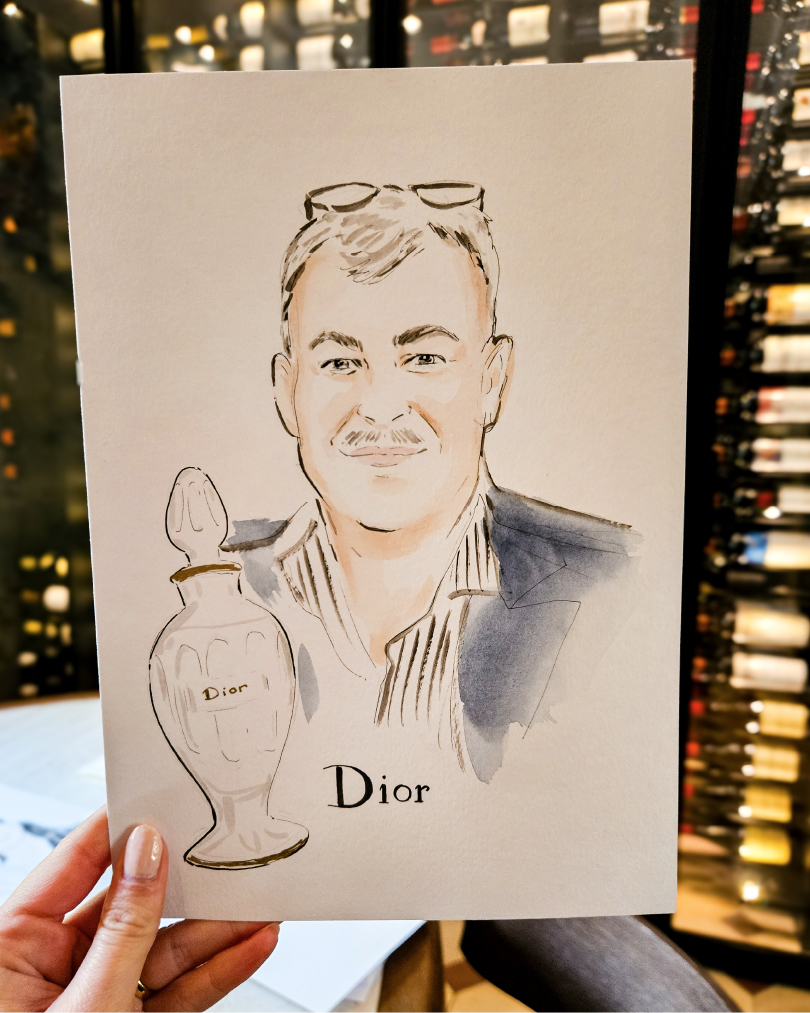 Live portrait made at an event for Dior of a man next to a Dior fragarance